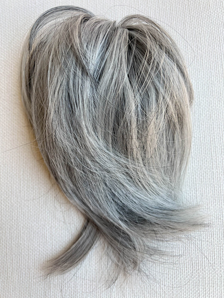 Messy gray hair piece bun#color_salt-and-pepper-grey