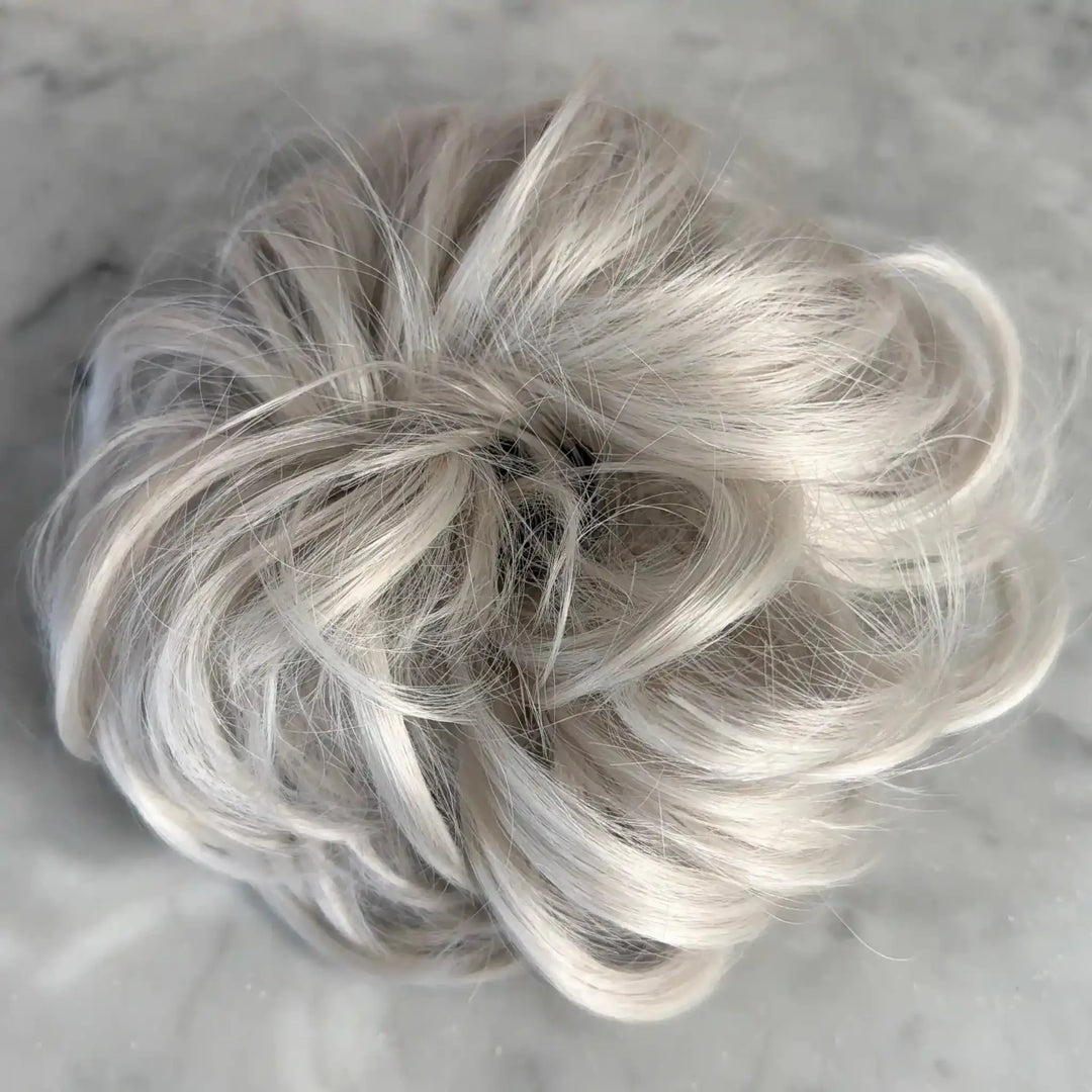 white platinum Blonde hair bun on a light gray background#color_white-platinum-blonde