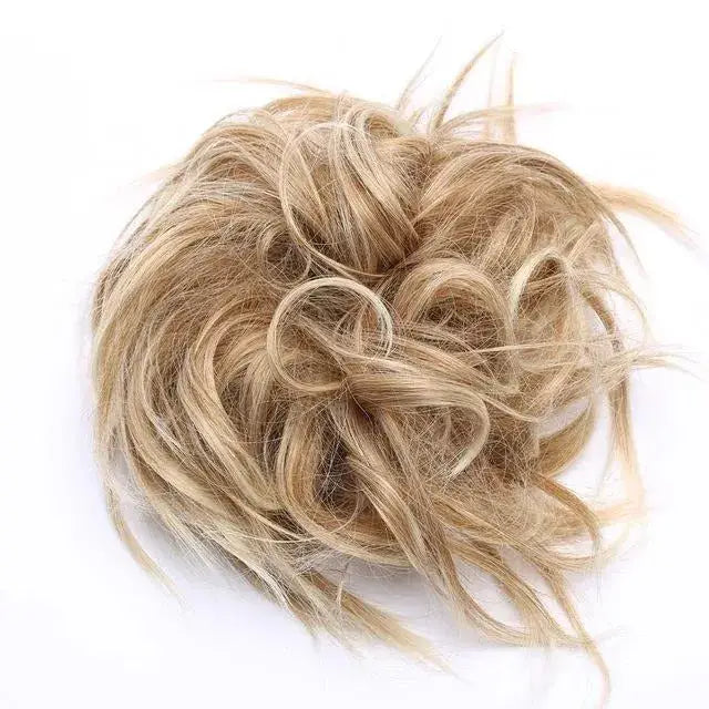 messy hair bun highlited#color_beach-blonde